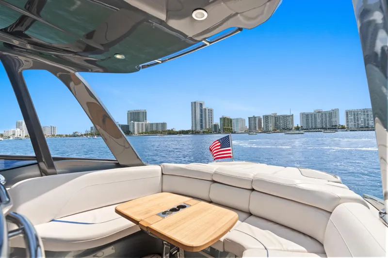 Mischief Yacht Photos Pics Luxurious 2020 Princess R35 yacht interior with city skyline and American flag.