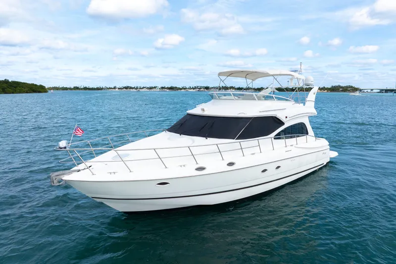  Yacht Photos Pics 2001 Cruisers Yachts 5000 Sedan Sport on blue ocean under clear sky.