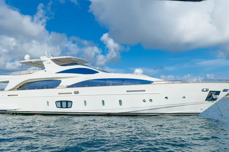  Yacht Photos Pics Luxury Azimut 105 yacht from 2010 on open water under blue sky.