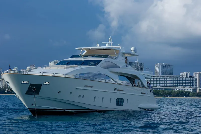  Yacht Photos Pics Luxurious 2010 Azimut 105 yacht cruising near urban skyline on a sunny day.