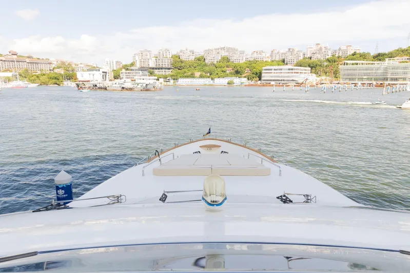  Yacht Photos Pics Bow view of 2010 Azimut 105 yacht in a scenic harbor setting.