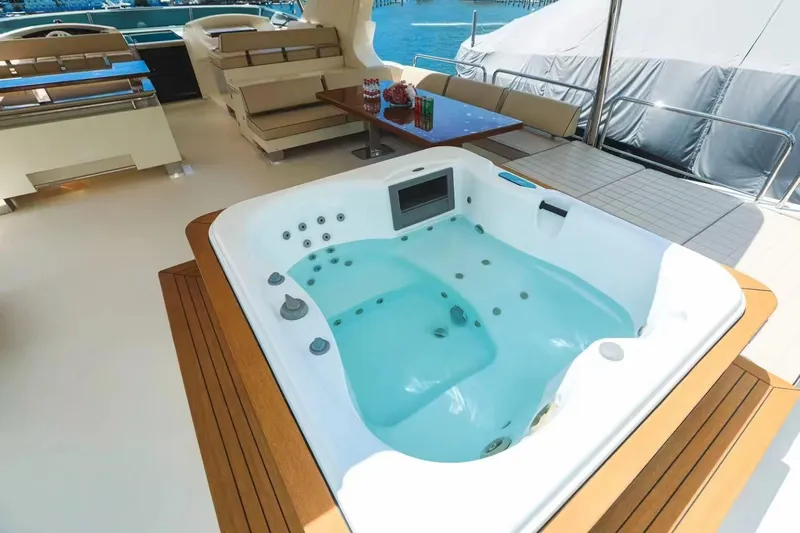  Yacht Photos Pics Luxurious Azimut 105 yacht deck with jacuzzi, seating, and ocean view, 2010 model.
