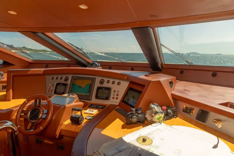  Yacht Photos Pics Luxurious Azimut 105 yacht cockpit with navigation equipment, ocean view, and modern controls.