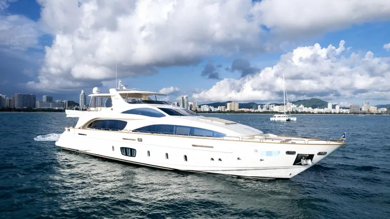  Yacht Photos Pics Luxurious 2010 Azimut 105 yacht cruising on open water under a partly cloudy sky.