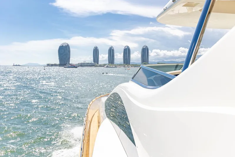  Yacht Photos Pics Azimut 105 yacht cruising near modern waterfront skyline, sunny day, 2010 model.