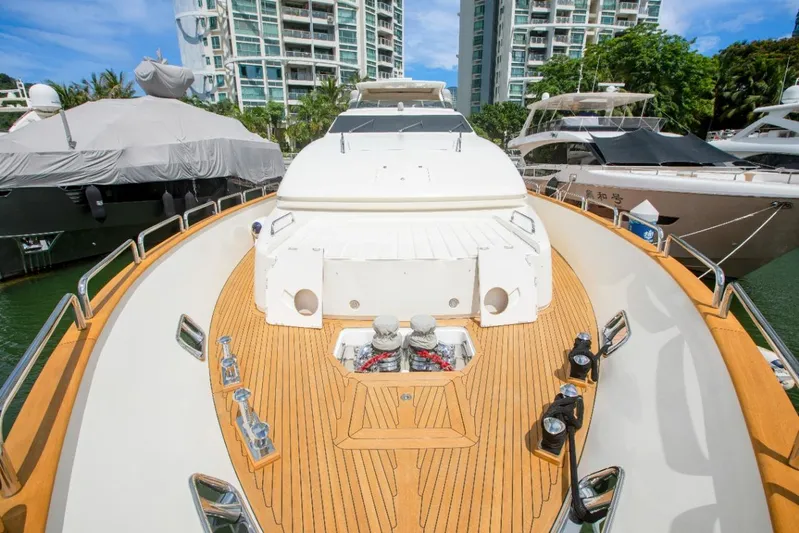  Yacht Photos Pics Luxurious 2010 Azimut 105 yacht docked, featuring sleek design and spacious deck.