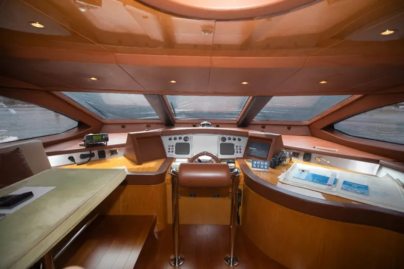  Yacht Photos Pics Luxurious helm of a 2010 Azimut 105 yacht with modern navigation equipment.