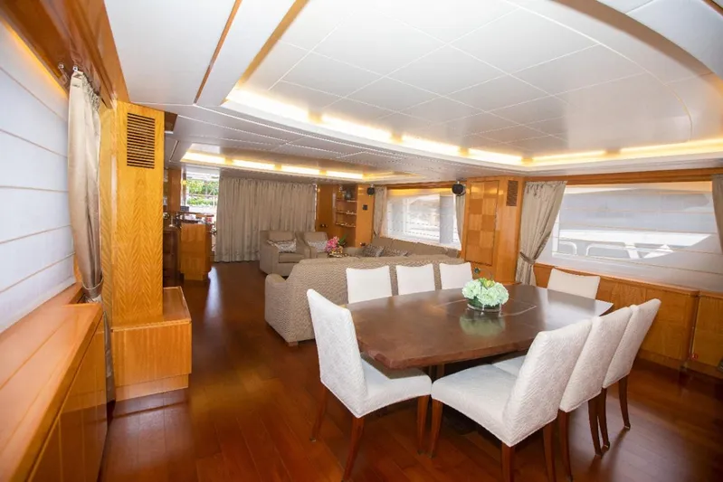  Yacht Photos Pics Luxurious interior of 2010 Azimut 105 yacht with elegant dining area and plush seating.