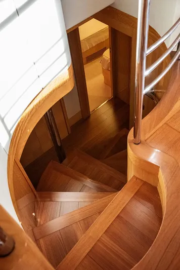  Yacht Photos Pics Wooden staircase inside 2010 Azimut 105 yacht, featuring elegant design and polished finish.