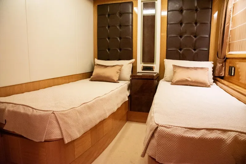  Yacht Photos Pics Luxurious twin bedroom on 2010 Azimut 105 yacht with elegant decor and plush bedding.
