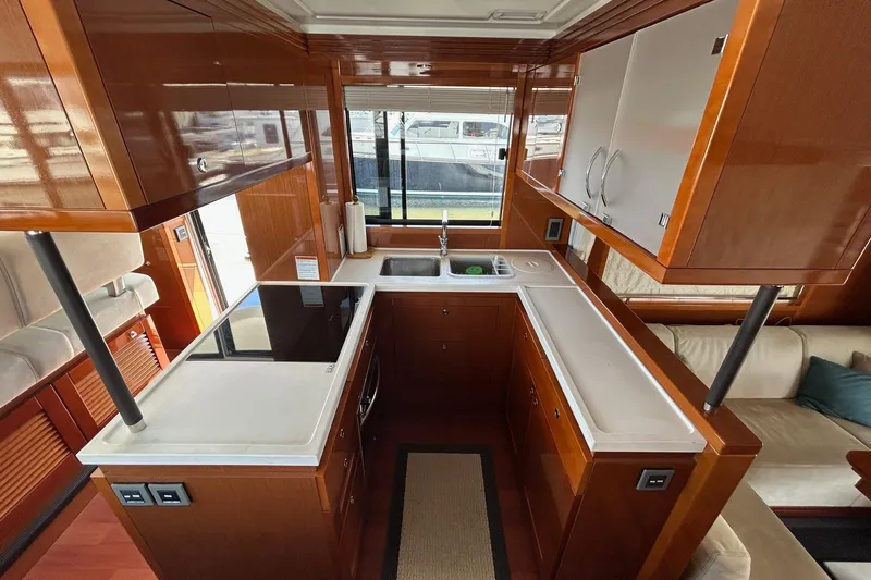 Smooth Yacht Photos Pics Luxurious kitchen interior of 2019 Beneteau Swift Trawler 50 with modern amenities.