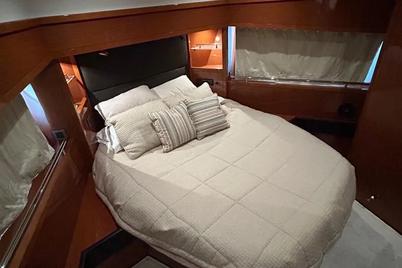 Smooth Yacht Photos Pics Luxurious bedroom interior of 2019 Beneteau Swift Trawler 50 with cozy bedding.