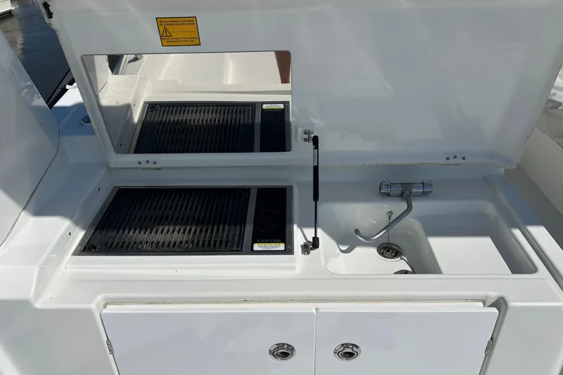 Smooth Yacht Photos Pics Outdoor kitchen on 2019 Beneteau Swift Trawler 50 with grill and sink.