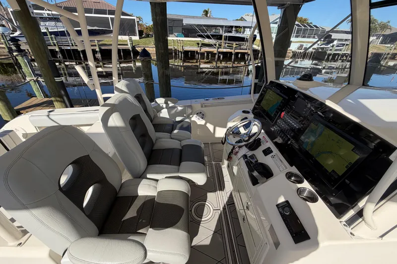  Yacht Photos Pics 2016 Cobia 344 Center Console boat interior with dual seats and advanced navigation system.