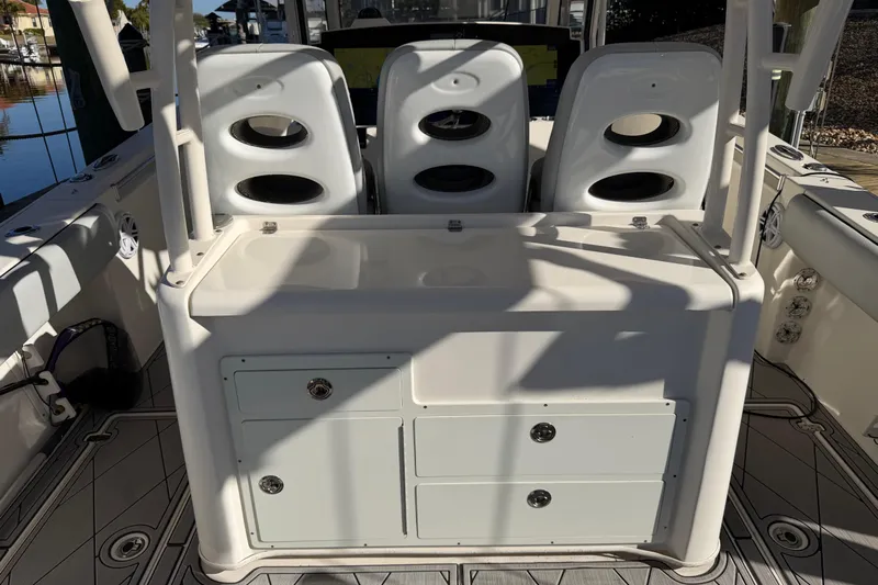  Yacht Photos Pics 2016 Cobia 344 Center Console boat interior with seating and storage compartments.