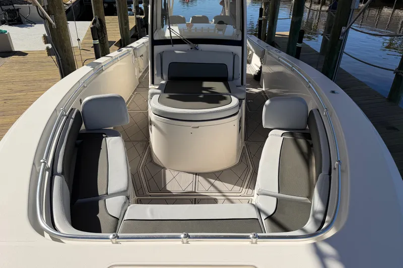  Yacht Photos Pics 2016 Cobia 344 Center Console boat interior with cushioned seating and sleek design.