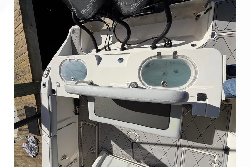  Yacht Photos Pics 2016 Cobia 344 Center Console boat deck with livewell and seating.