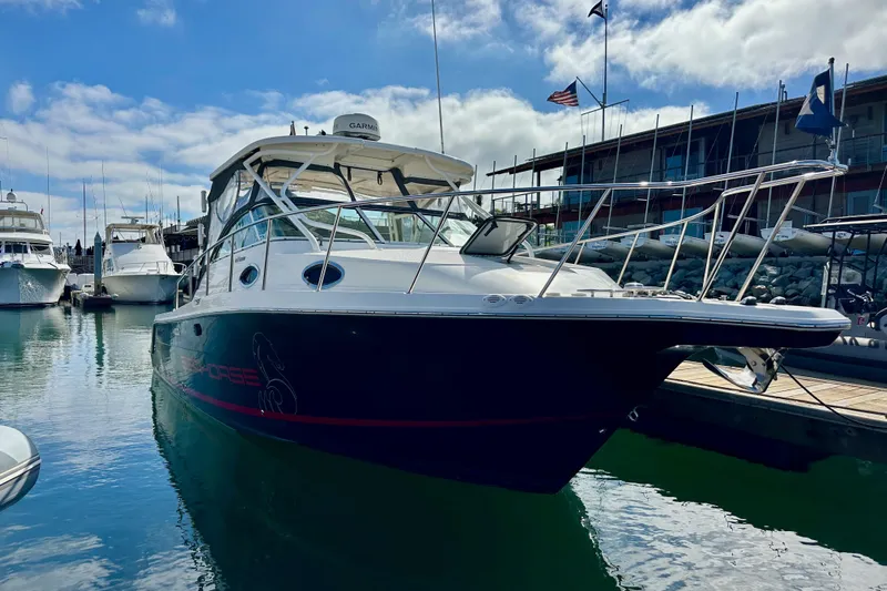 Seahorse Yacht Photos Pics 2018 Wellcraft 290 Coastal boat docked at marina under blue sky.