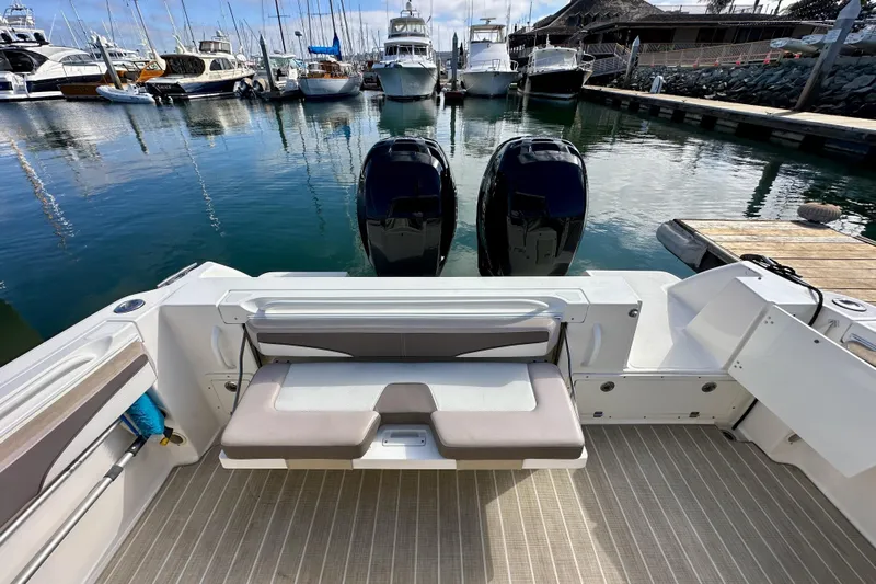 Seahorse Yacht Photos Pics 2018 Wellcraft 290 Coastal boat with dual engines docked at a marina.