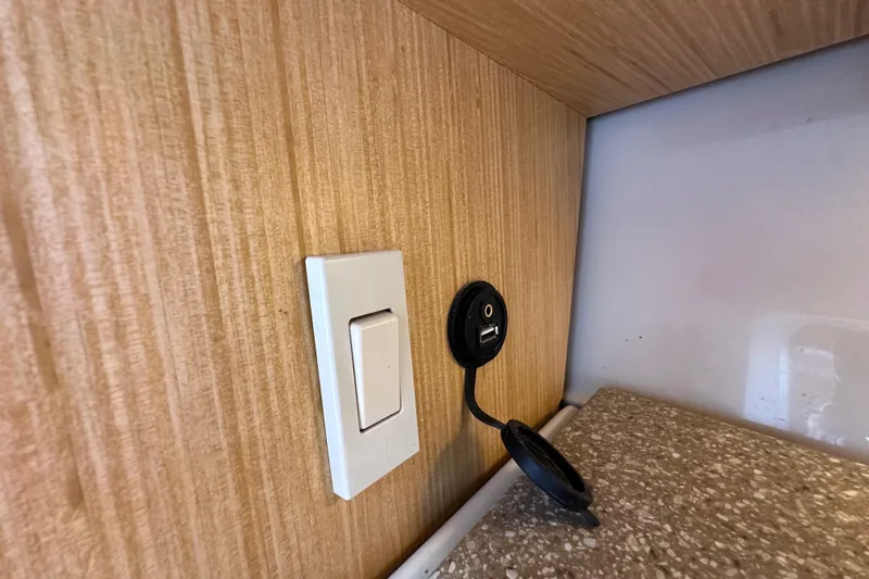 Seahorse Yacht Photos Pics Light switch and USB port on Wellcraft 290 Coastal 2018 boat interior.