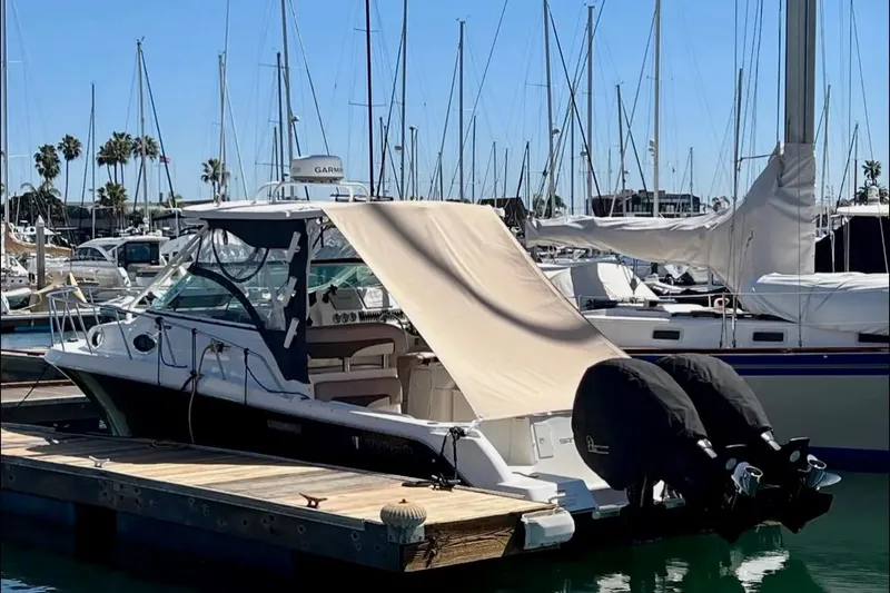 Seahorse Yacht Photos Pics 2018 Wellcraft 290 Coastal boat docked at marina with covered outboard engines.