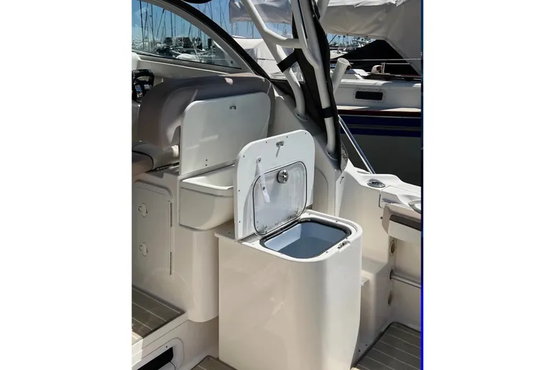 Seahorse Yacht Photos Pics 2018 Wellcraft 290 Coastal boat interior with open storage compartment.