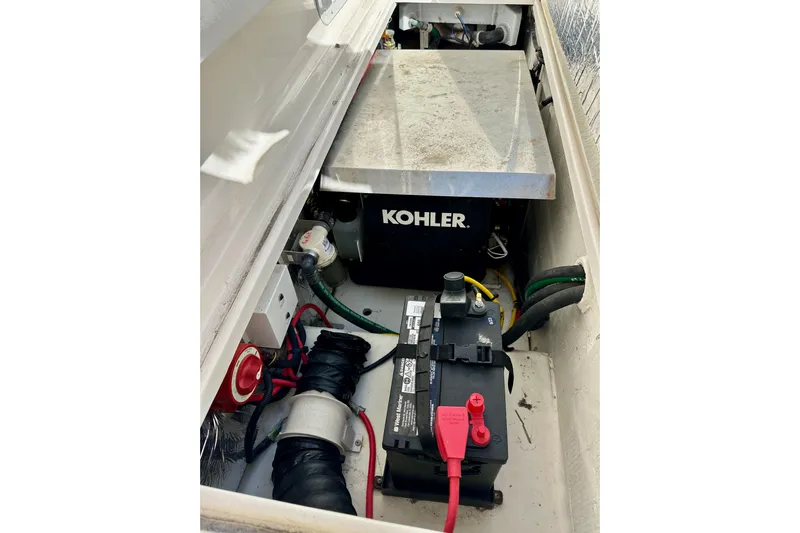 Seahorse Yacht Photos Pics 2018 Wellcraft 290 Coastal engine compartment with Kohler generator and battery setup.
