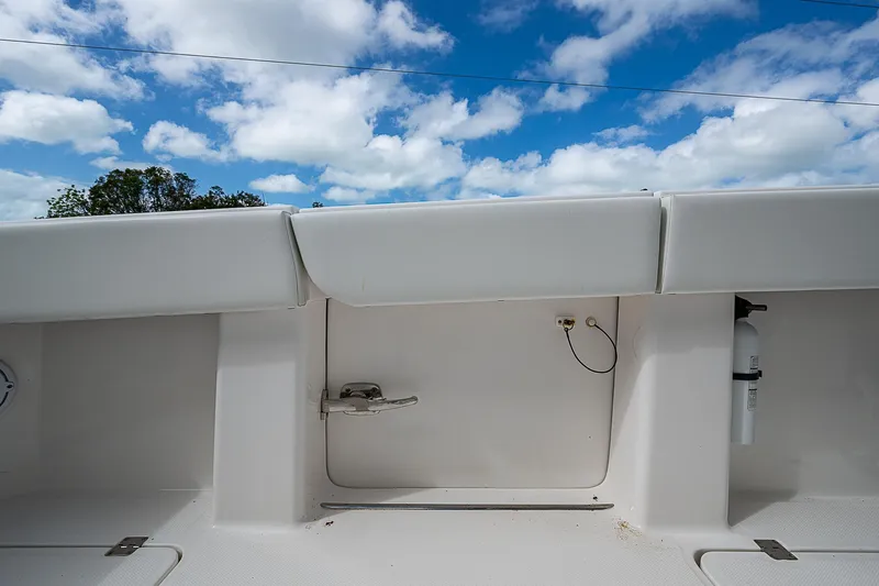 Hoosier Hooker Yacht Photos Pics Invincible 40 Catamaran 2021 deck view with storage compartments under a blue sky.