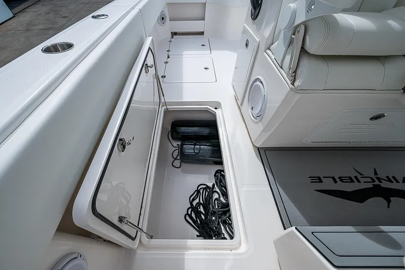 Hoosier Hooker Yacht Photos Pics Storage compartment on 2021 Invincible 40 Catamaran, featuring ropes and equipment.