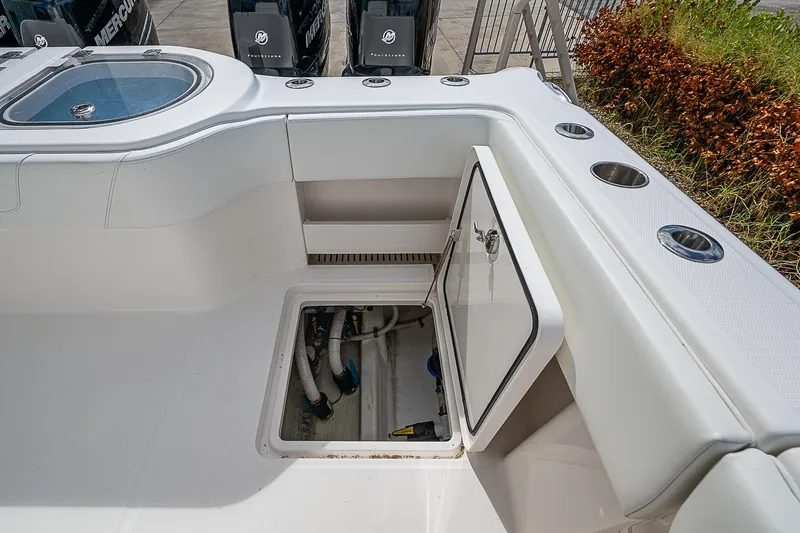 Hoosier Hooker Yacht Photos Pics Invincible 40 Catamaran 2021 deck with open hatch and storage compartment.