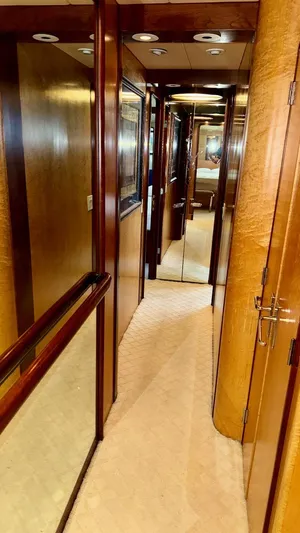 Adventurer Yacht Photos Pics Luxurious wooden hallway interior of 1987 Burger 86 Raised Pilothouse yacht.