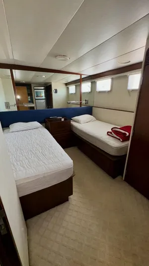 Adventurer Yacht Photos Pics Twin beds in a cozy cabin of a 1987 Burger 86 Raised Pilothouse yacht.