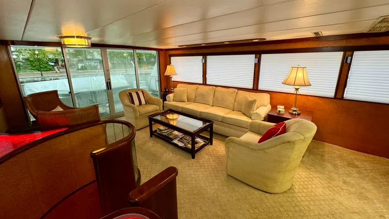 Adventurer Yacht Photos Pics Luxurious interior of 1987 Burger 86 Raised Pilothouse yacht with elegant seating and decor.