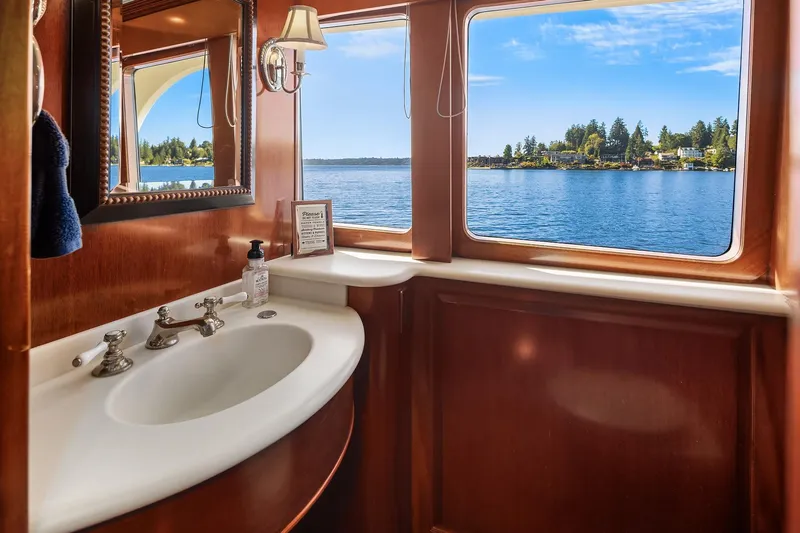 Jade Panama Yacht Photos Pics Luxurious 2001 Rayburn Flush Deck yacht bathroom with scenic water view.