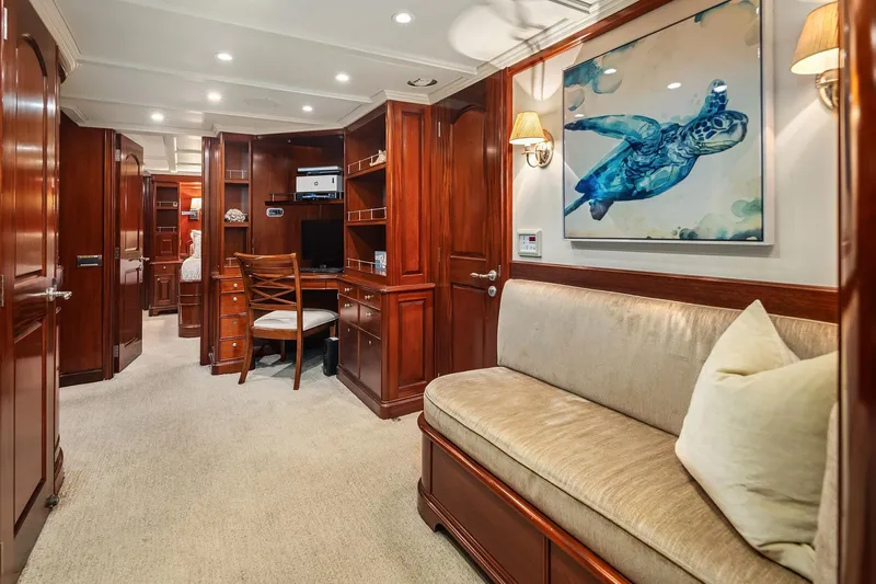 Jade Panama Yacht Photos Pics Luxurious 2001 Rayburn Flush Deck yacht interior with elegant wood finishes and marine artwork.