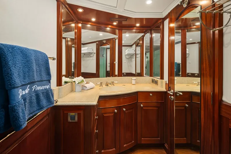 Jade Panama Yacht Photos Pics Luxurious bathroom on 2001 Rayburn Flush Deck yacht with elegant wood cabinetry and mirrors.