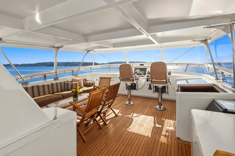 Jade Panama Yacht Photos Pics Luxurious 2001 Rayburn Flush Deck yacht interior with seating and ocean view.