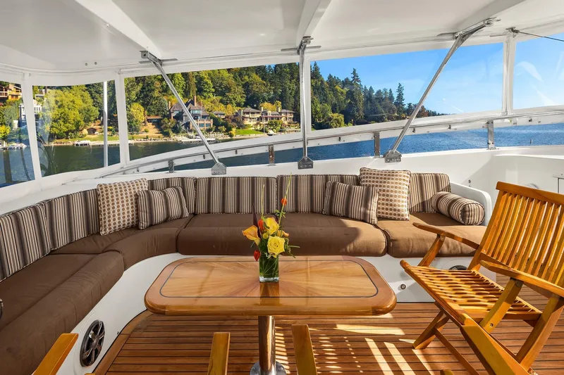 Jade Panama Yacht Photos Pics Luxurious 2001 Rayburn Flush Deck yacht interior with elegant seating and scenic waterfront view.