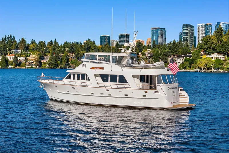 Jade Panama Yacht Photos Pics Rayburn Flush Deck 2001 yacht on water with city skyline background.
