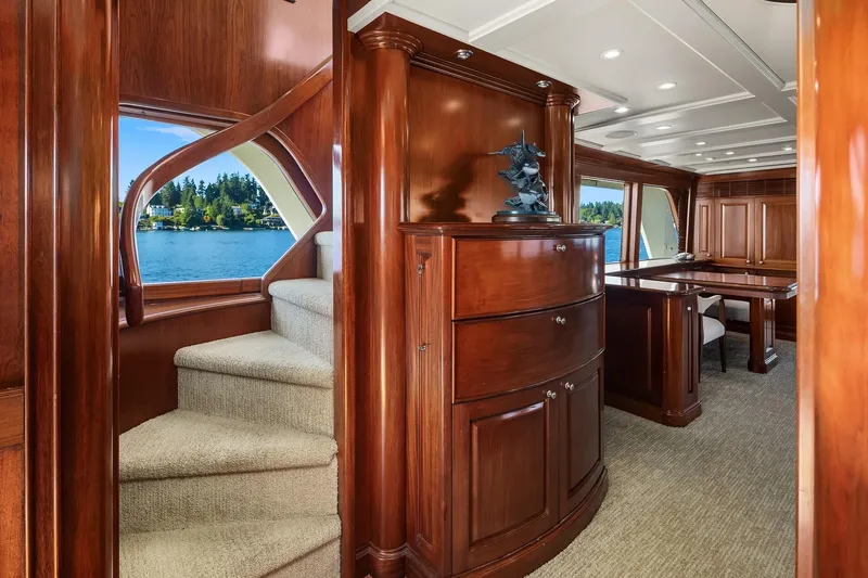 Jade Panama Yacht Photos Pics Luxurious interior of 2001 Rayburn Flush Deck yacht with elegant wood finishes and scenic water view.