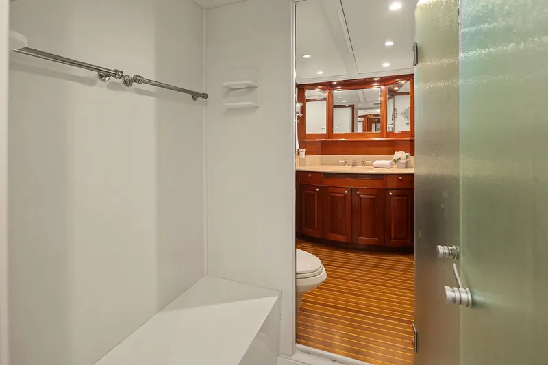 Jade Panama Yacht Photos Pics Luxurious bathroom on 2001 Rayburn Flush Deck yacht with wooden cabinetry and modern fixtures.