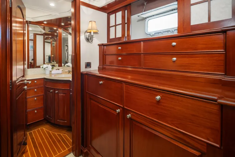 Jade Panama Yacht Photos Pics Luxurious wooden interior of 2001 Rayburn Flush Deck yacht with elegant cabinetry and bathroom.