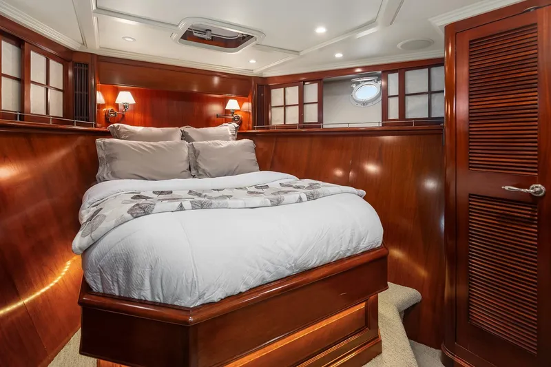 Jade Panama Yacht Photos Pics Luxurious cabin interior of 2001 Rayburn Flush Deck yacht with elegant wood paneling.