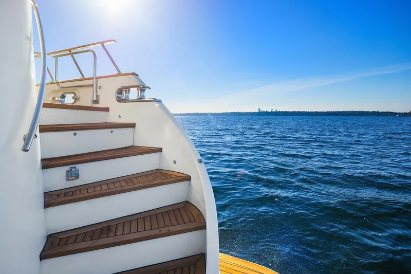 Jade Panama Yacht Photos Pics Staircase on 2001 Rayburn Flush Deck yacht overlooking serene ocean view.