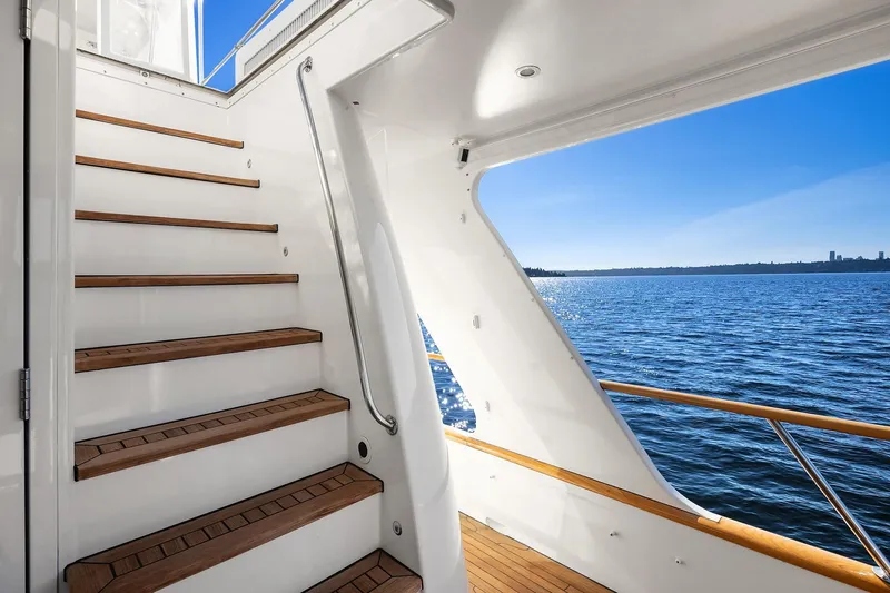 Jade Panama Yacht Photos Pics Staircase on 2001 Rayburn Flush Deck yacht overlooking serene blue ocean.