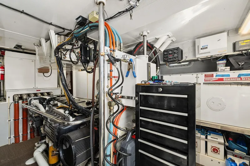 Jade Panama Yacht Photos Pics Engine room of 2001 Rayburn Flush Deck yacht with tools and equipment.