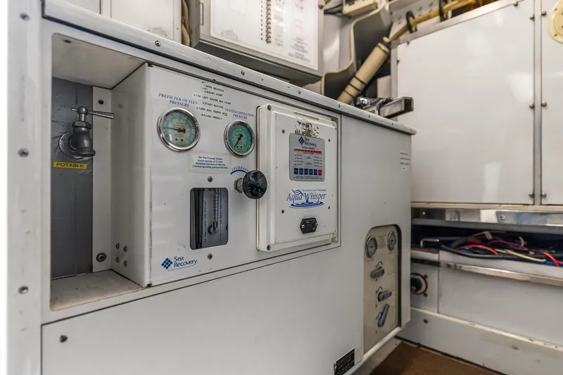 Jade Panama Yacht Photos Pics Control panel of a 2001 Rayburn Flush Deck yacht, featuring gauges and switches.