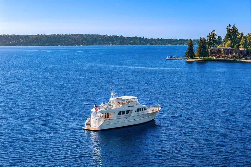 Jade Panama Yacht Photos Pics 2001 Rayburn Flush Deck yacht cruising on a serene blue lake.