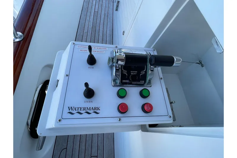 Jade Panama Yacht Photos Pics Control panel of a 2001 Rayburn Flush Deck yacht with joystick and buttons.
