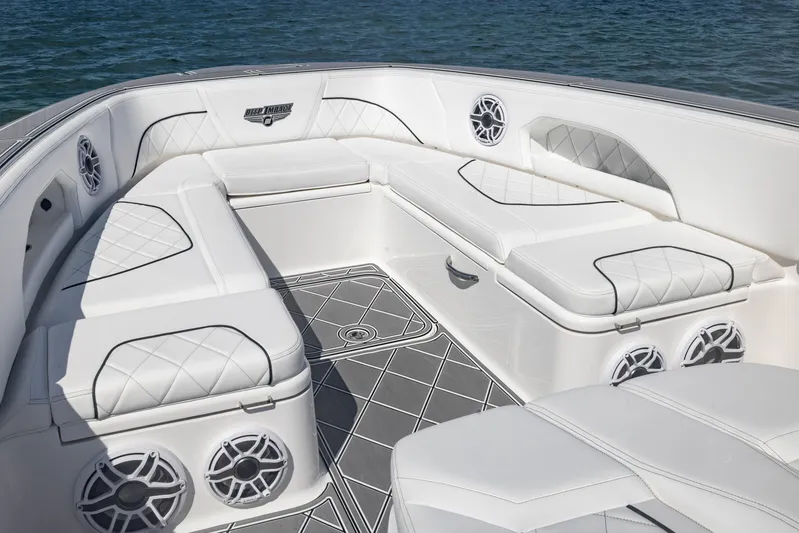  Yacht Photos Pics Luxurious seating area on 2024 Deep Impact 399 Sport boat, featuring elegant white upholstery.
